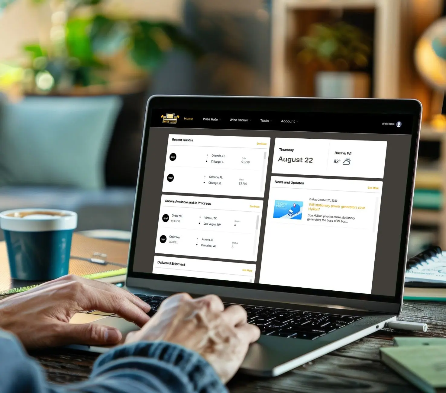 •	A logistic professional using the Wizeload software on his laptop to monitor shipping.